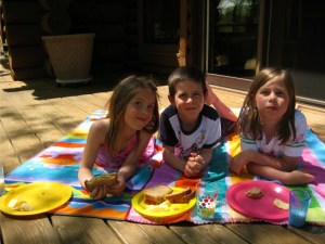 Cousins havin' a little picnic on the deck.