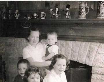 In front of the fireplace and mantel